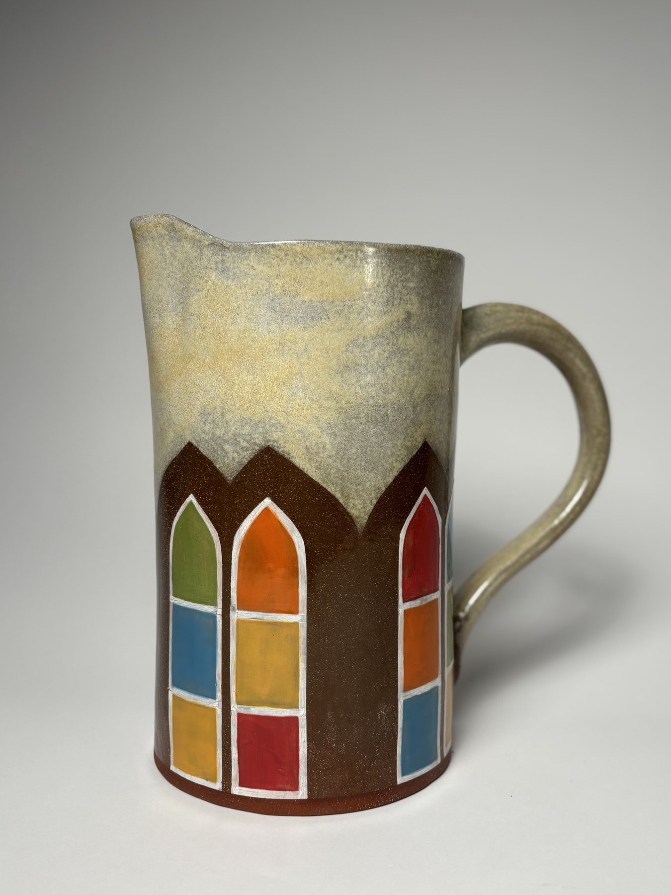 Pitcher with rows of stained-glass style windows