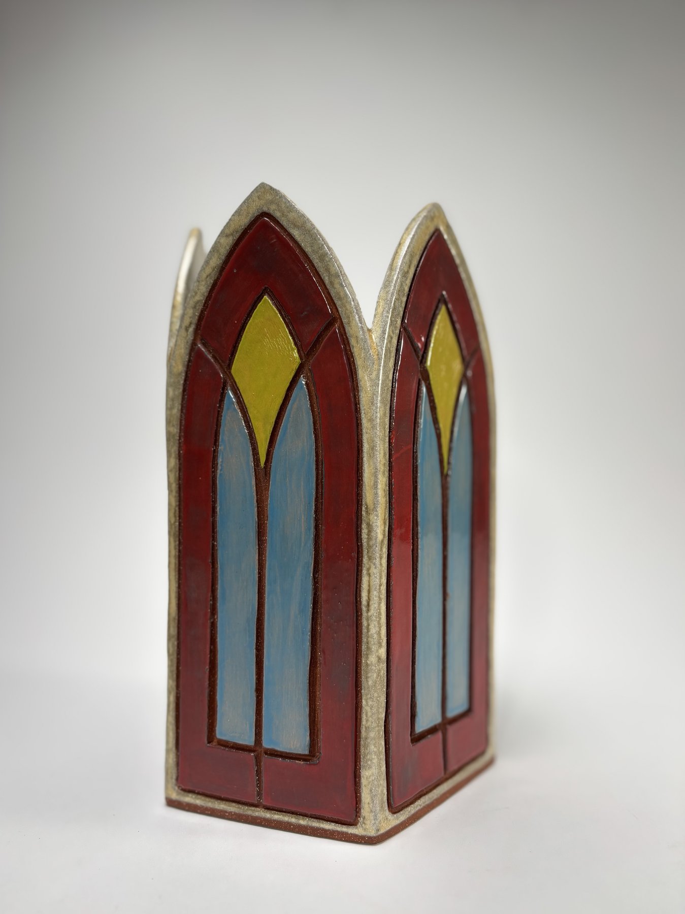 New gothic arch vase, deep red, blue, and yellow stained-glass glaze