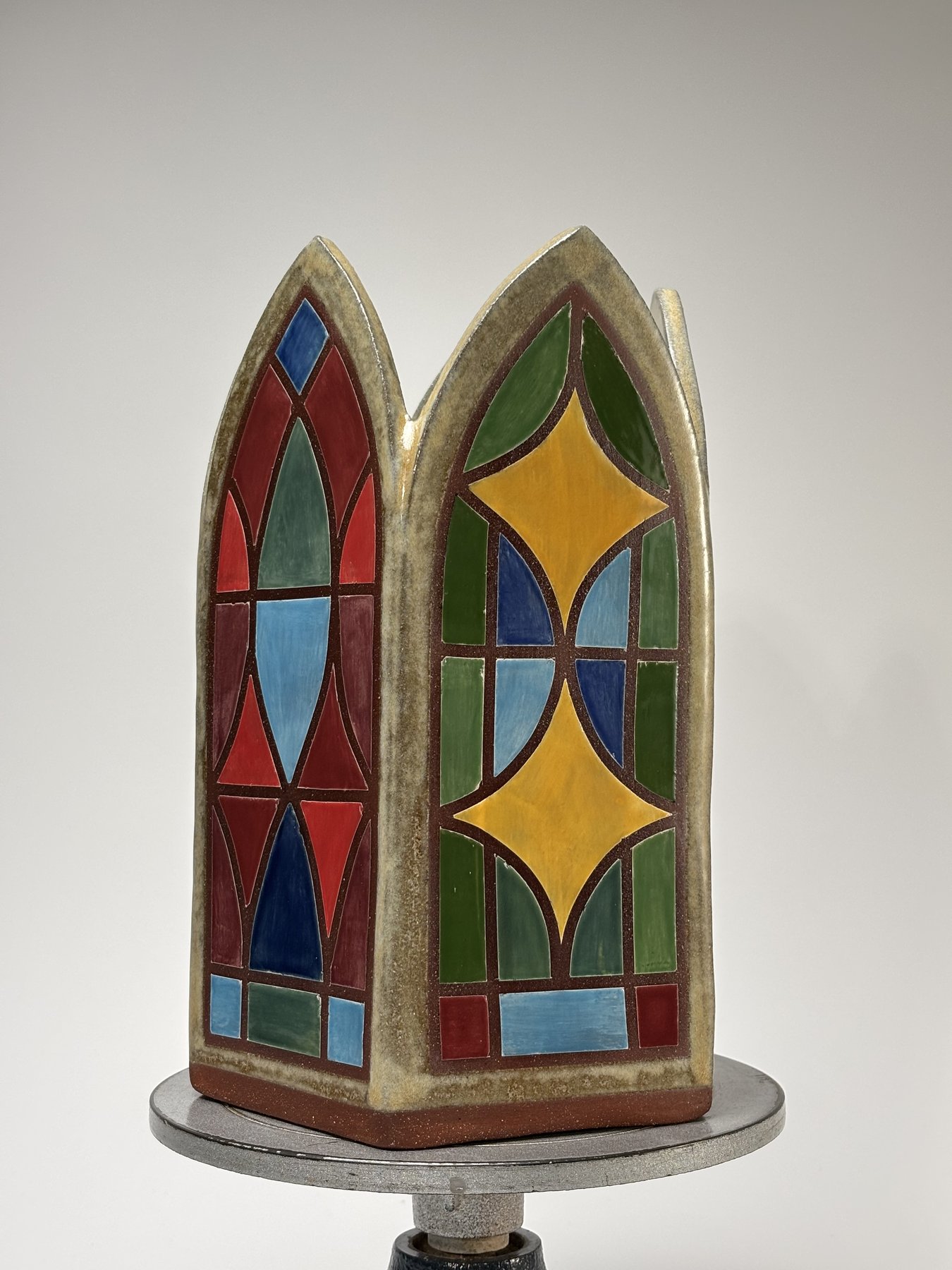 Faceted star vase, green and yellow star pattern stained-glass glaze